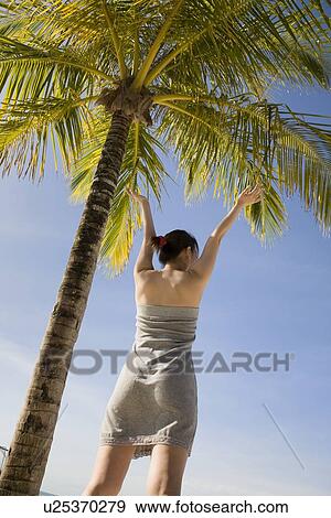 Stock Photo - Young woman stretching. Fotosearch