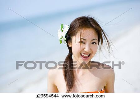 Young woman walking at beach View Large Photo Image Picture - Young woman walking at beach. Fotosearch