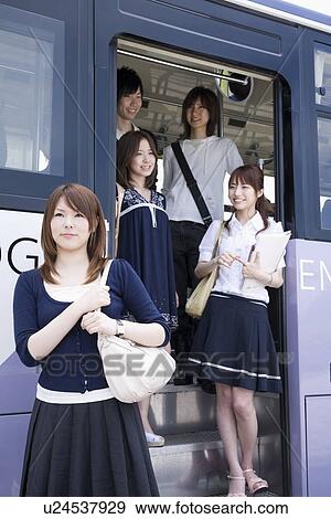 College students getting off the bus View Large Photo Image Stock Photo - College students getting off the bus. Fotosearch