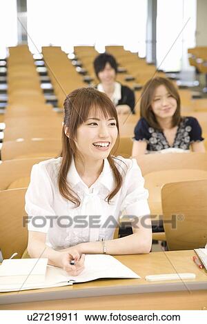 Stock Image - College students studying in lecture room. Fotosearch