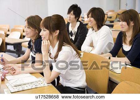 Stock Photo - College students studying in lecture room. Fotosearch