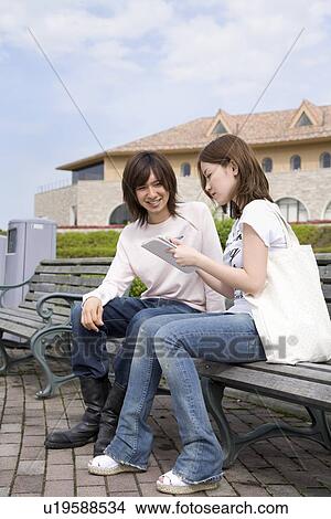 Picture - College students talking. Fotosearch