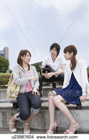 Picture - College students talking. Fotosearch