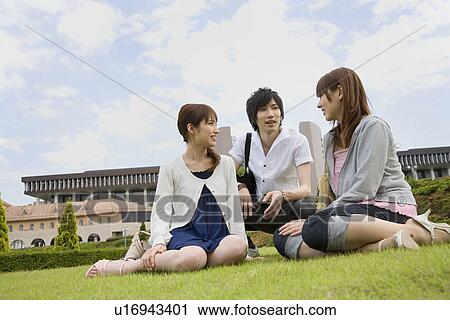 Stock Image - College students talking. Fotosearch