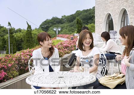 Stock Image - College students talking. Fotosearch