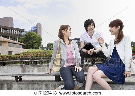 Stock Image - College students talking. Fotosearch