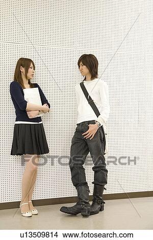 Picture - Two college students talking. Fotosearch