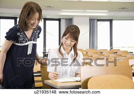 Stock Photo - Two young women studying at college. Fotosearch