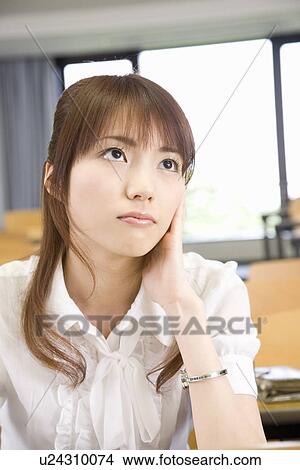 Picture - Young woman studying. Fotosearch