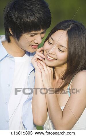 Stock Image - Young couple bonding together. Fotosearch