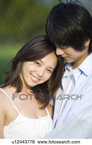 Stock Photo - Young couple bonding together. Fotosearch