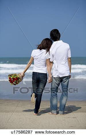 Stock Photo - Young couple bonding together. Fotosearch