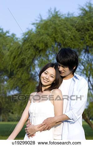Young couple bonding together View Large Photo Image Stock Photo - Young couple bonding together. Fotosearch