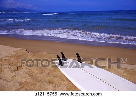 Close-up of a surfboard on beach View Large Photo Image Stock Photography - Close-up of a surfboard on beach. Fotosearch