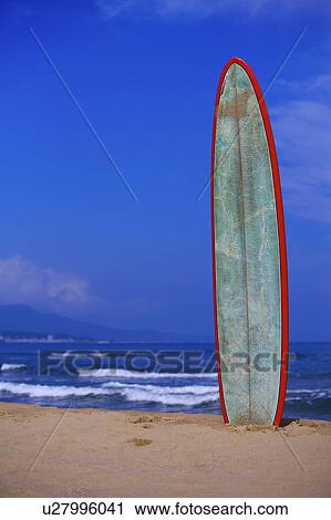 Close-up of a surfboard standing on beach View Large Photo Image Stock Image - Close-up of a surfboard standing on beach. Fotosearch