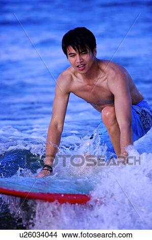 Man surfing on the sea and looking away View Large Photo Image Picture - Man surfing on the sea and looking away. Fotosearch