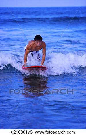 Man surfing on the sea skillfully View Large Photo Image Stock Image - Man surfing on the sea skillfully. Fotosearch