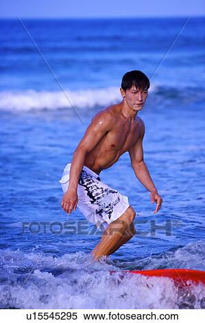 Man surfing on the sea skillfully View Large Photo Image Stock Photography - Man surfing on the sea skillfully. Fotosearch