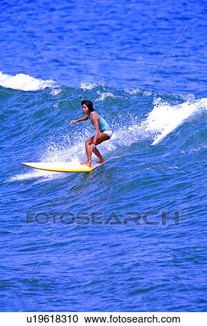 Woman surfing on the sea skillfully View Large Photo Image Stock Image - Woman surfing on the sea skillfully. Fotosearch