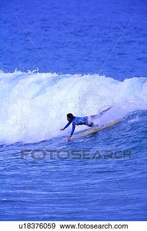 Young woman surfer fighting against huge wave at sea View Large Photo Image Stock Photo - Young woman surfer fighting against huge wave at sea. Fotosearch