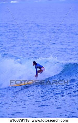 Young woman surfing on the sea skillfully View Large Photo Image Stock Photo - Young woman surfing on the sea skillfully. Fotosearch