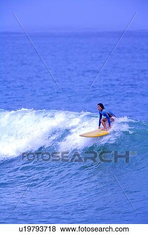 Young woman surfing on the sea skillfully View Large Photo Image Stock Photo - Young woman surfing on the sea skillfully. Fotosearch
