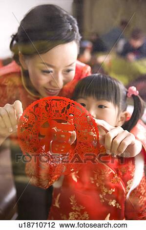 Young mother and daughter sticking a decoupage View Large Photo Image Stock Image - Young mother and daughter sticking a decoupage. Fotosearch