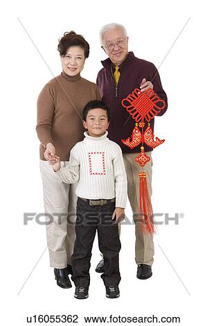 Elderly couple with a little boy holding a tassel and smiling at the camera View Large Photo Image Stock Image - Elderly couple with a little boy holding a tassel and smiling at the camera. Fotosearch