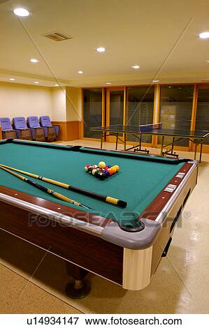 Stock Photo - A pool table in the gymnasium. Fotosearch