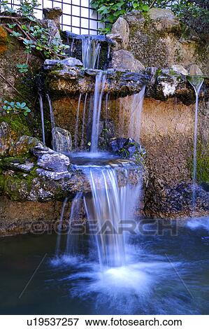 Stock Photo - Close-up of a little waterfall. Fotosearch