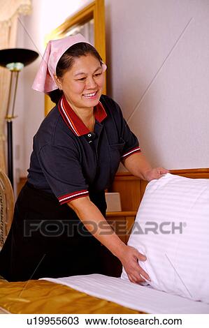 Women cleaning the room in the hotel View Large Photo Image Stock Image - Women cleaning the room in the hotel. Fotosearch