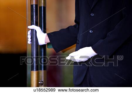 Young man holding handle and wearing white glove View Large Photo Image Stock Photo - Young man holding handle and wearing white glove. Fotosearch