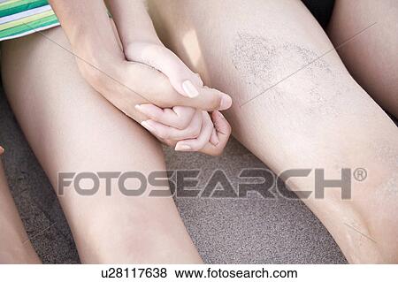 Hand of couple on a beach View Large Photo Image Stock Photo - Hand of couple on a beach. Fotosearch