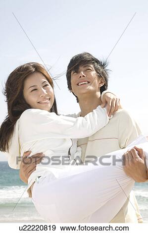 Japanese man lifting lover up View Large Photo Image Stock Photo - Japanese man lifting lover up. Fotosearch