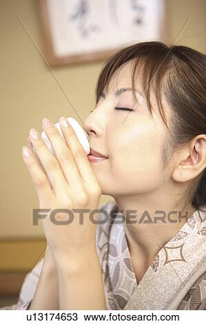 Japanese woman drinking Japanese sake View Large Photo Image Stock Image - Japanese woman drinking Japanese sake. Fotosearch