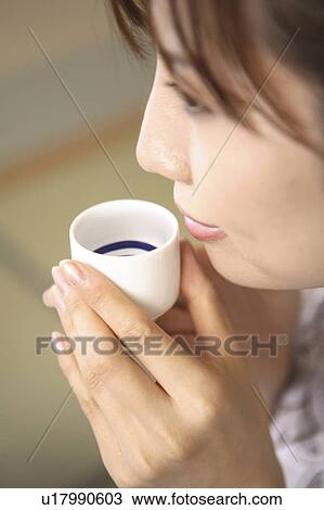 Japanese woman drinking Japanese sake View Large Photo Image Stock Image - Japanese woman drinking Japanese sake. Fotosearch