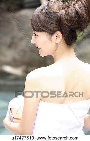 Stock Image - Japanese woman in the open-air bath. Fotosearch