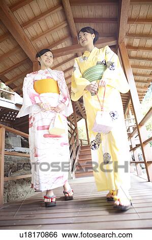 Japanese woman putting on a yukata View Large Photo Image Stock Photograph - Japanese woman putting on a yukata. Fotosearch