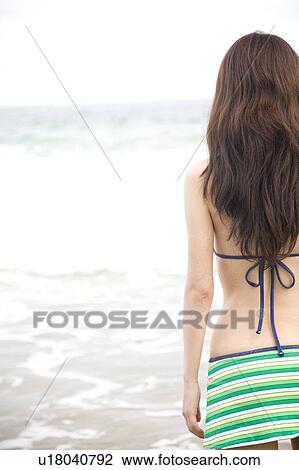 Stock Image - Back figure of Japanese woman in swimsuit. Fotosearch