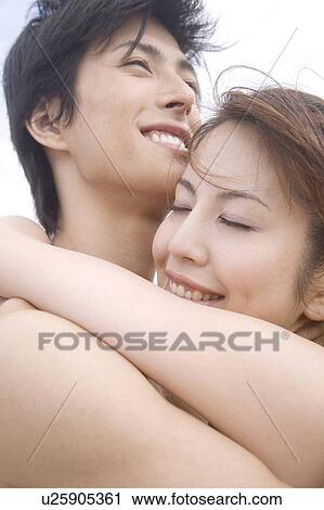 Japanese couple hugging each other View Large Photo Image Stock Image - Japanese couple hugging each other. Fotosearch
