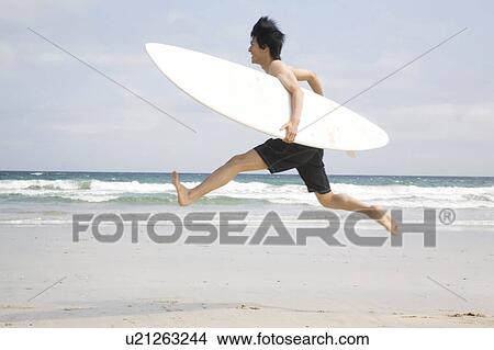 Picture - Japanese man jumping. Fotosearch