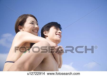 Picture - Smiling Japanese couple. Fotosearch