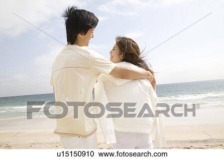 Woman embraced lover's arm View Large Photo Image Stock Image - Woman embraced lover's arm. Fotosearch