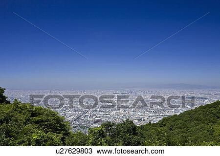 Stock Image - Distant View of Osaka City. Fotosearch