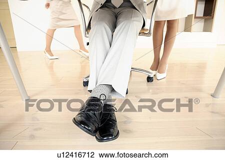 Stock Image - Foot of Japanese office worker. Fotosearch