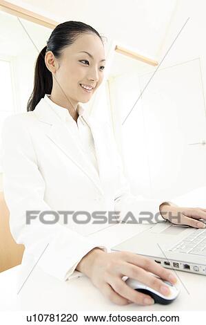 Office lady operating a PC View Large Photo Image Stock Image - Office lady operating a PC. Fotosearch