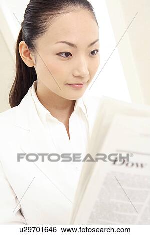 Office lady reading a newspaper View Large Photo Image Stock Photograph - Office lady reading a newspaper. Fotosearch