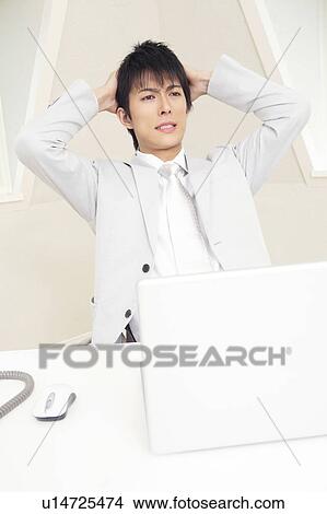 Picture - Office worker at wit's end. Fotosearch