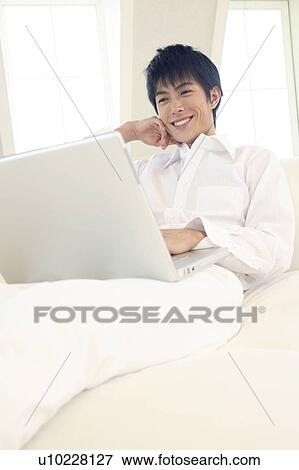 Stock Photo - Office worker taking a rest. Fotosearch