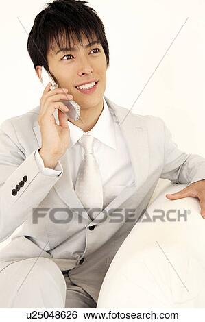 Stock Photograph - Offife worker talking with cell phone. Fotosearch